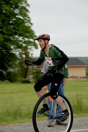 Joe crusing along on his 36" wheel.